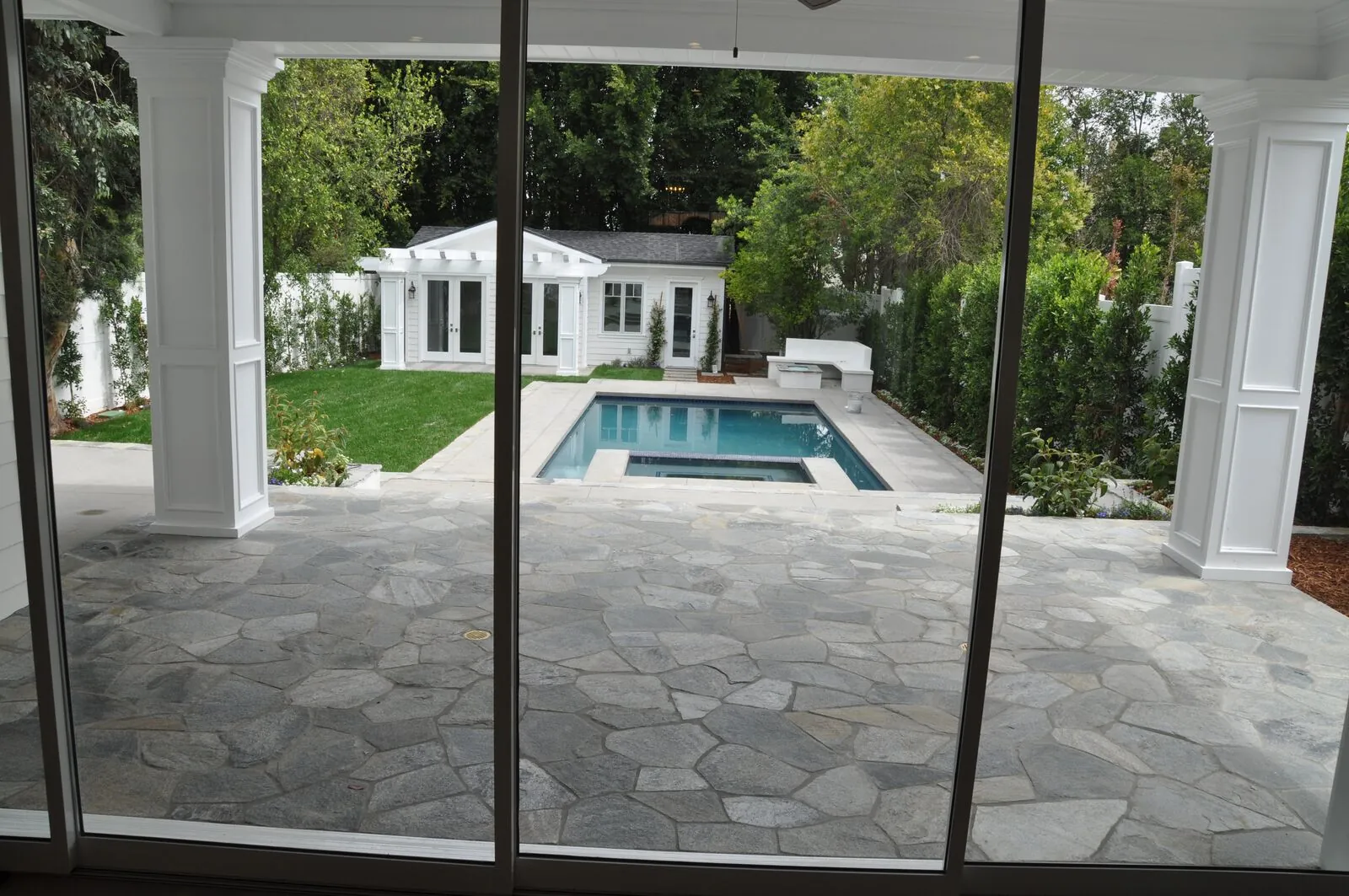 Backyard and covered patio at a Westec custom home in Sherman Oaks